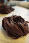 This savory chocolate pasta, I was told by a chef in Montalcino, Tuscany, is best served with a cream sauce..preferable an alfredo type sauce with extra Pecorino Romano for topping.