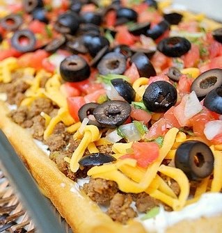Overhead view of an Easy Taco Pizza prior to being baked.