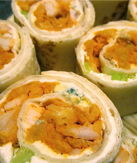 Recipe for Buffalo Chicken Pinwheels - These are incredibly easy to make for your party buffet. These appetizers pack all of the big flavors of Buffalo Chicken wings and their traditional accompaniments into one easy to eat, mess-free treat