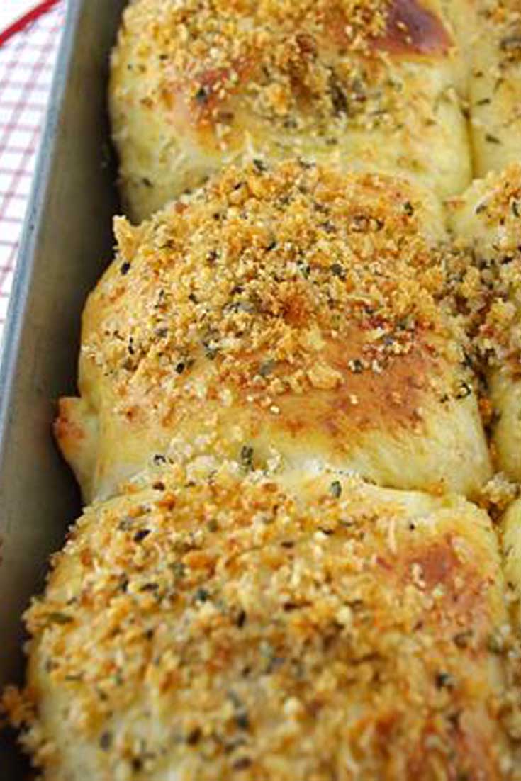These Parmesan Dinner Rolls are loaded with freshly grated Parmesan to make a gorgeous, light, fluffy and moist dinner roll full of Parmesan flavor. #bread #rolls #baking #parmesan