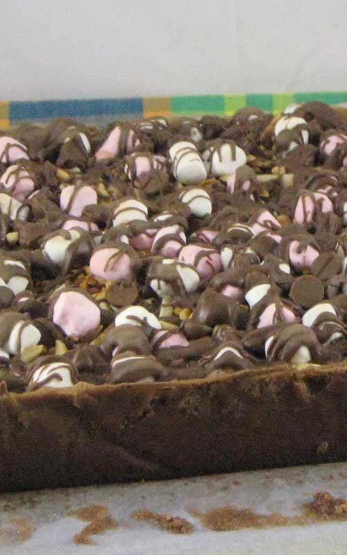 Recipe for Rocky Road Brownies - These brownies are amazing, with their deep chocolate flavor topped with soft and gooey marshmallows all jumbled together with chocolate chips and nuts.