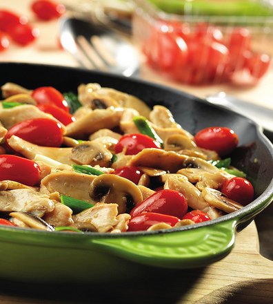 Recipe for Chicken with Grape Tomatoes and Mushrooms - Here's a way to get great flavor, fast. This quick-cooking skillet dish features strips of sautéed chicken with mushrooms, green onions and grape tomatoes.