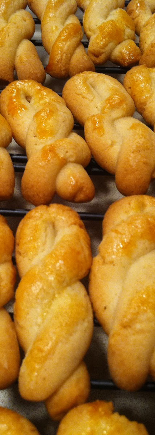 Koulourakia are Greek butter cookies. They are slightly sweet, with vanilla, and glazed with an egg wash.  And they are delicious, a simple flavor but one of the best around. #greek #cookies #dessert