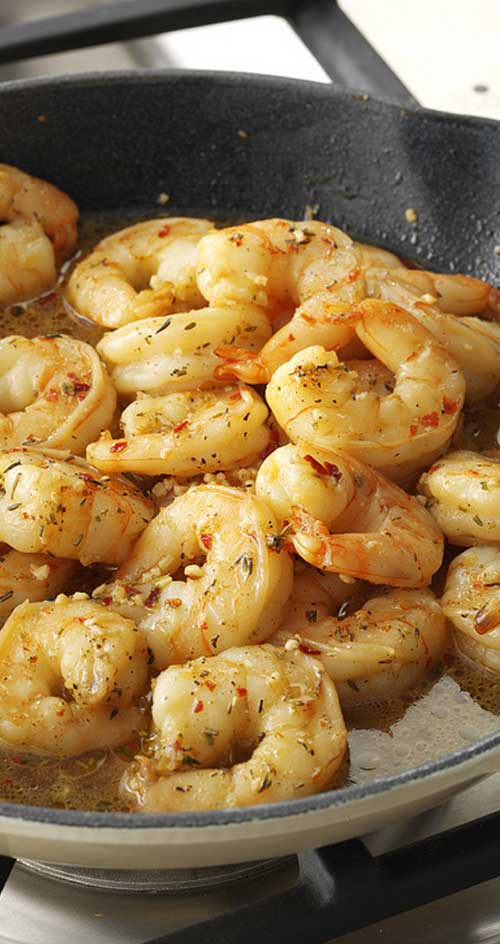 Recipe for Easy Cajun Shrimp Skillet - Indulge in this scrumptious Cajun shrimp recipe this Fat Tuesday. This easy seafood dish is loaded with bold spices, so grab some garlic bread to soak up the flavorful broth! It\'s excellent served with hot and creamy grits and a cold beer. #shrimp #seafood #dinnerideas #cajun