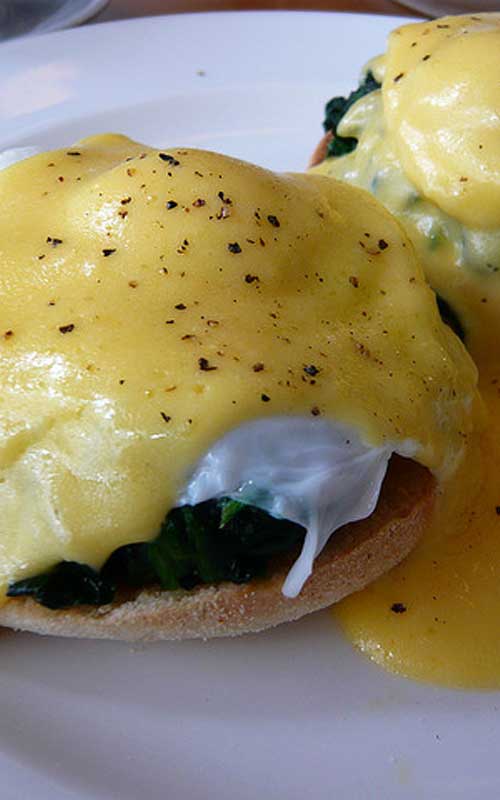 Eggs Florentine Recipe - This variation on the classic eggs Benedict uses spinach instead of Canadian bacon. The hollandaise sauce is prepared over a double boiler, ensuring it cooks slowly and gently.