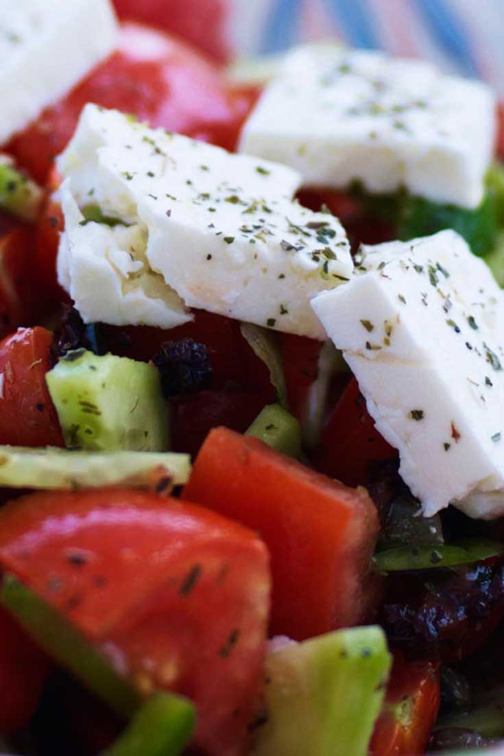 This traditional Greek Salad is a fresh, tasty and sating meal. Wonderful on it\'s own or as a side. It contains a range of crunchy and juicy vegetables, as well as herbs and traditional Greek Feta cheese. #saladrecipe #greekfood #greeksalad