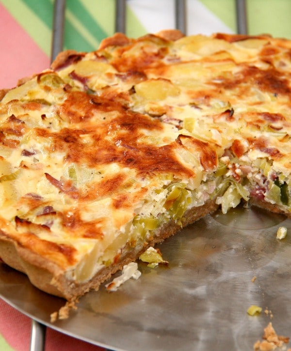 Corned beef quiche is a delicious way to use your corned beef leftovers.  A buttery pie crust is filled with eggs and studded with corned beef, gruyere cheese, and sauerkraut.
