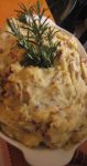 Fortunate are those who can snip fresh rosemary from their backyard herb gardens. These Garlic Rosemary Mashed Potatoes are made richer and more delicious with satisfying garlic and Parmesan cheese.
