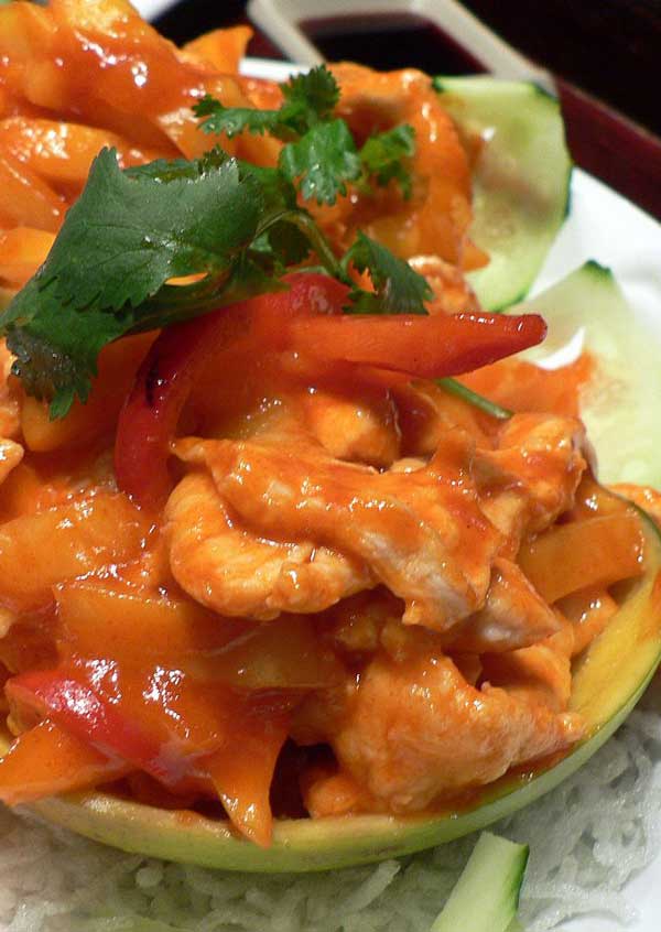 Recipe for Asian Mango Chicken - Bring Hawaii to your plate with this dish of chicken smothered in a rich mango sauce.