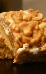 Payday Cookie Bars Recipe – These bars will satisfy any Payday craving. A buttery crust is topped with a sticky mixture of marshmallows, peanuts and rice crispies for crunch.