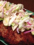 Recipe for Pork Milanese with Apple Cabbage Slaw – Even if its freezing outside, the flavors of this dish will have you dreaming of blooming flowers, leaves on the trees and chirping birds!