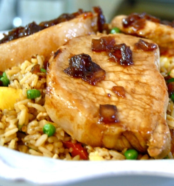 This recipe for Sweet Soy Glazed Pork Chops with Pineapple Fried Rice is a great mix of salty and sweet and a delicious Asian-inspired twist on classic pork chops.