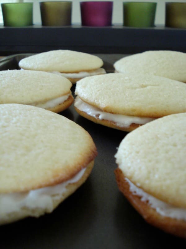 The original Whoopie Pie is actually chocolate cake cookie filled with a fluffy white icing, so these Lemon Whoopie Pies are quite the twist, but delicious no less.