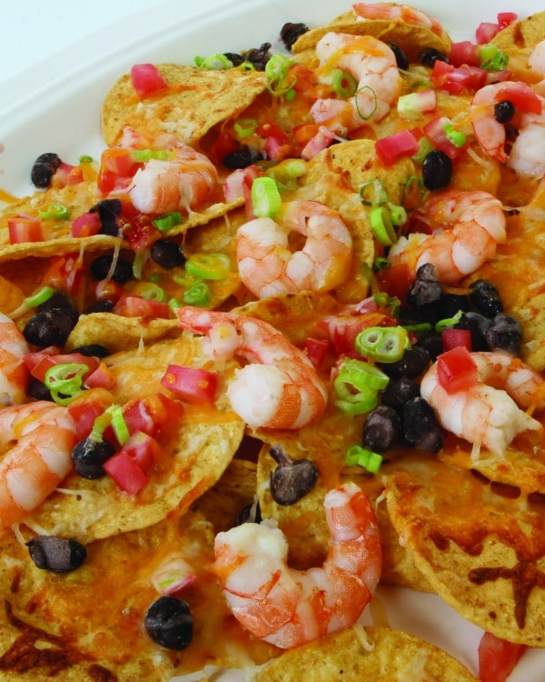 The easiest way to get the family together for a meal is with a delicious, homemade dish with tasty ingredients, such as the one's in these Quick-and-Easy Cheesy Gulf Shrimp Nachos.