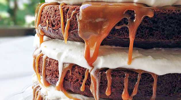 You need this Caramel Macchiato Cake in your life! It has everything you love about the classic Starbucks drink: 3 layers of rich espresso cake, whipped cream frosting, and caramel filling!